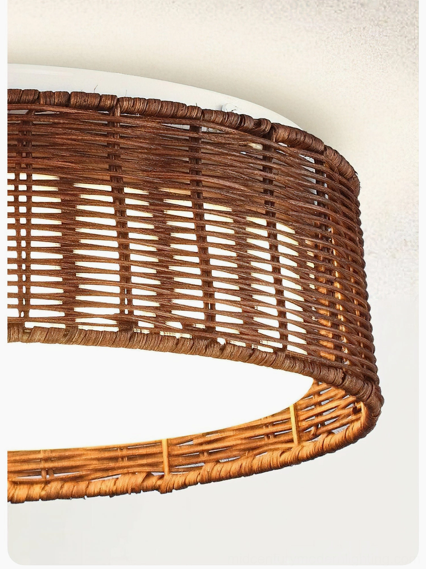 Close-up side view of Bayou rattan ceiling light showing intricate hand-woven texture detail and construction quality