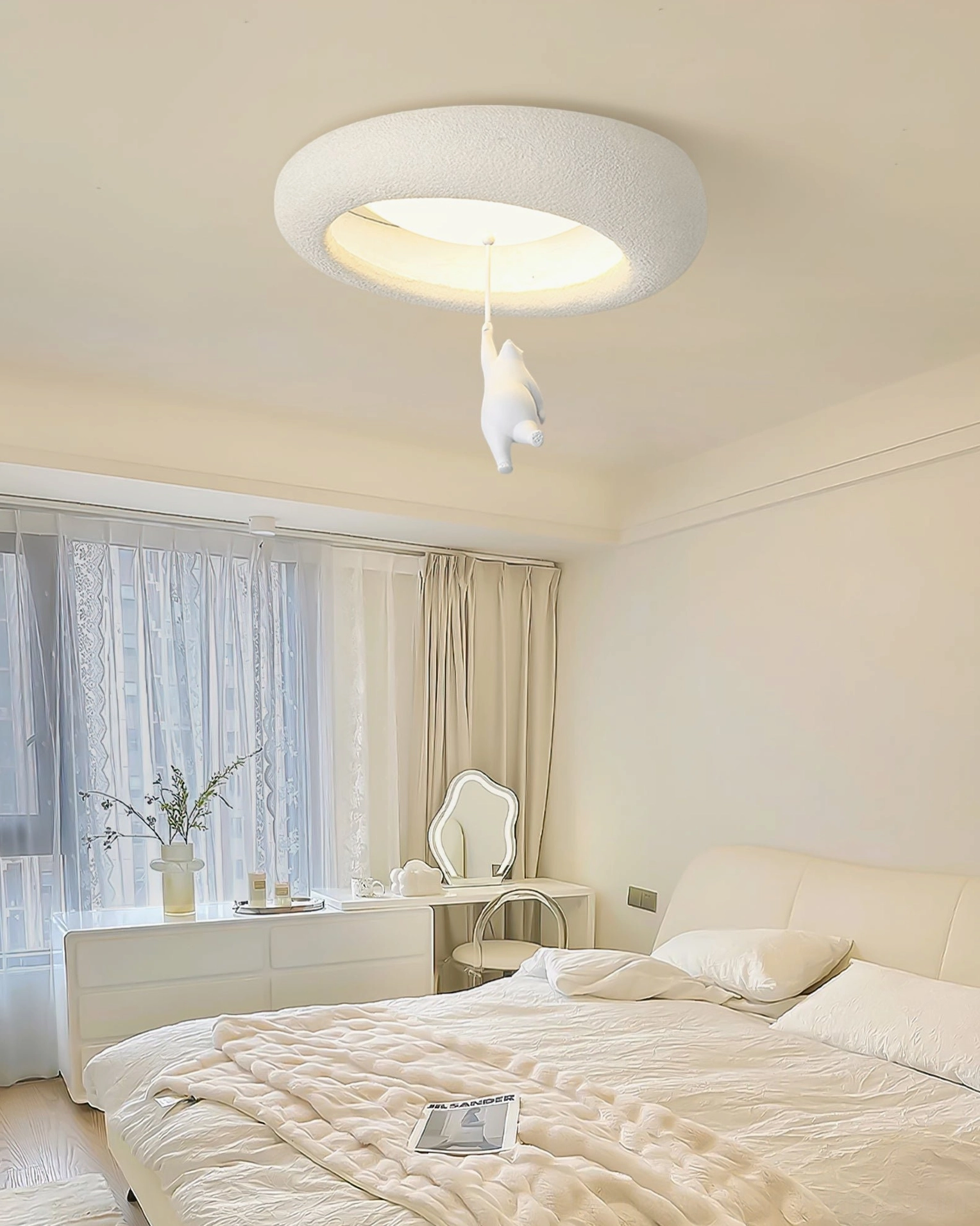 Modern bear ceiling fixture mounted in minimalist bedroom with vanity dresser and neutral decor