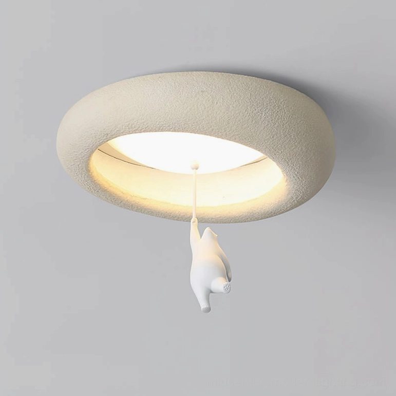 Overhead close-up of bear ceiling light with central warm LED light and textured creamy outer ring
