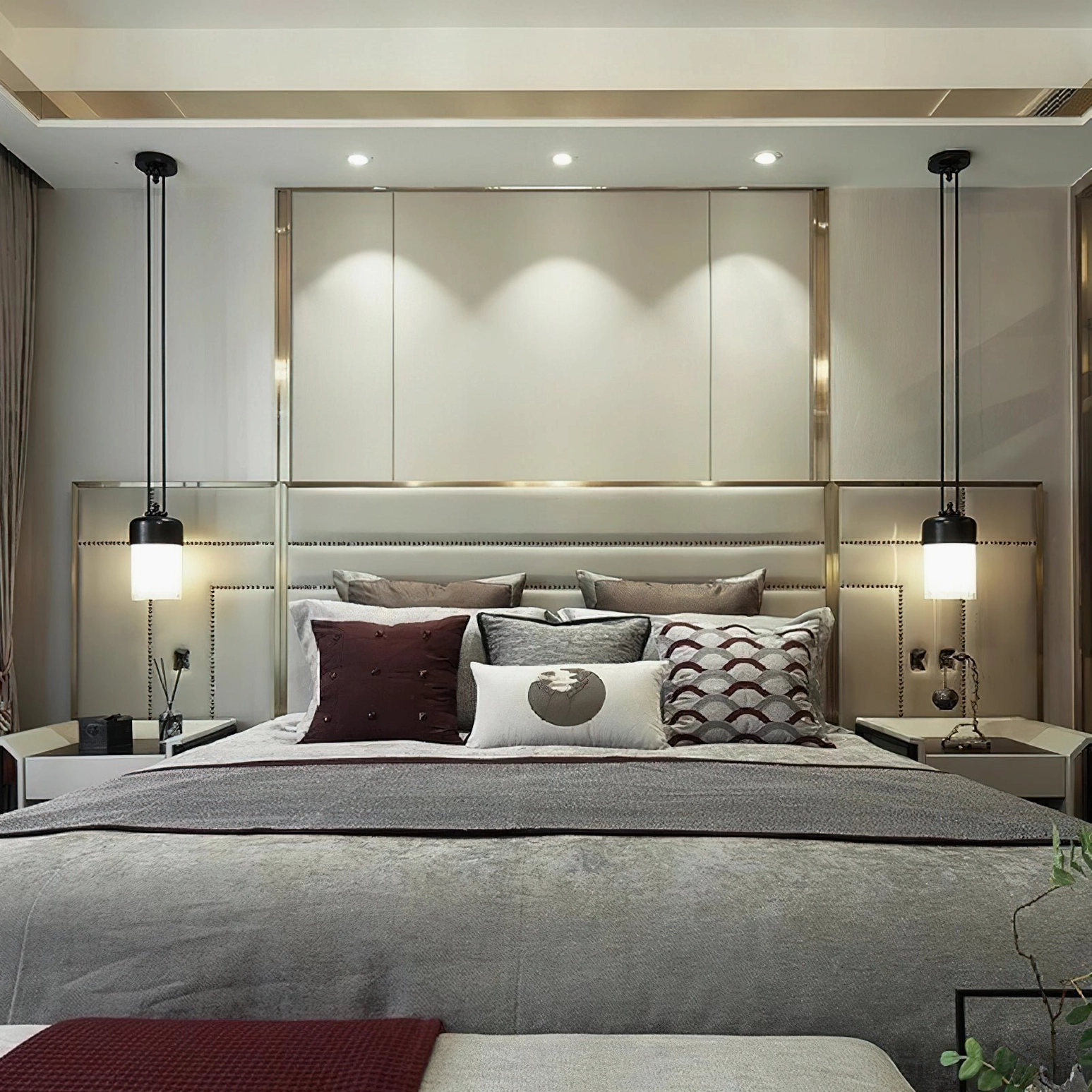 Twin bedside pendant lamps in master bedroom, wide interior shot featuring synchronized fixtures and luxury neutral bedding
