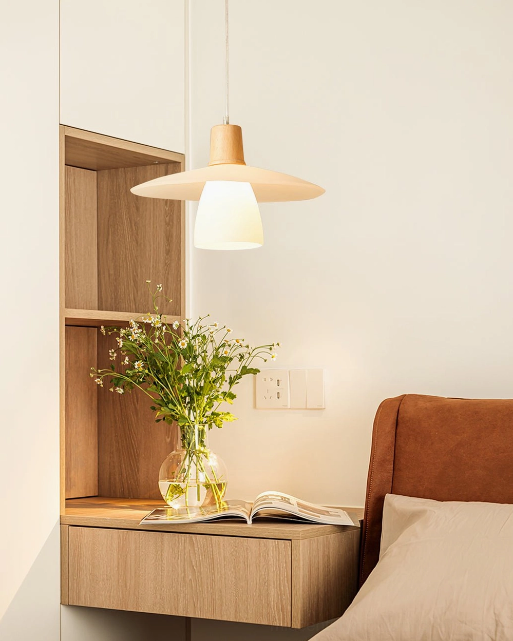 Bedroom study pendant light mounted above nightstand in Scandinavian bedroom corner