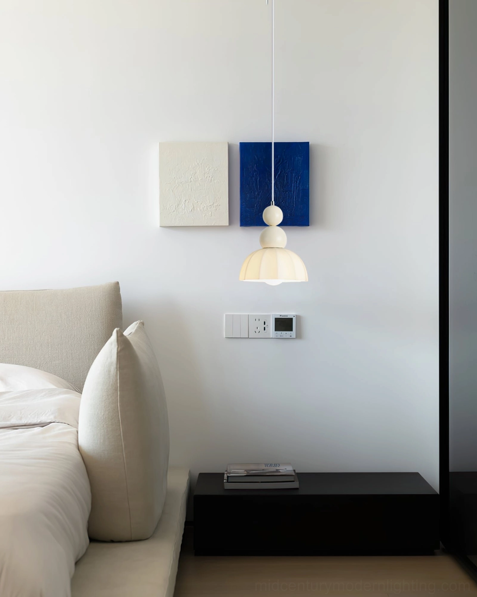 Warm beige gourd bubble pendant lamp in calm minimalist bedroom with neutral bedding and wall art