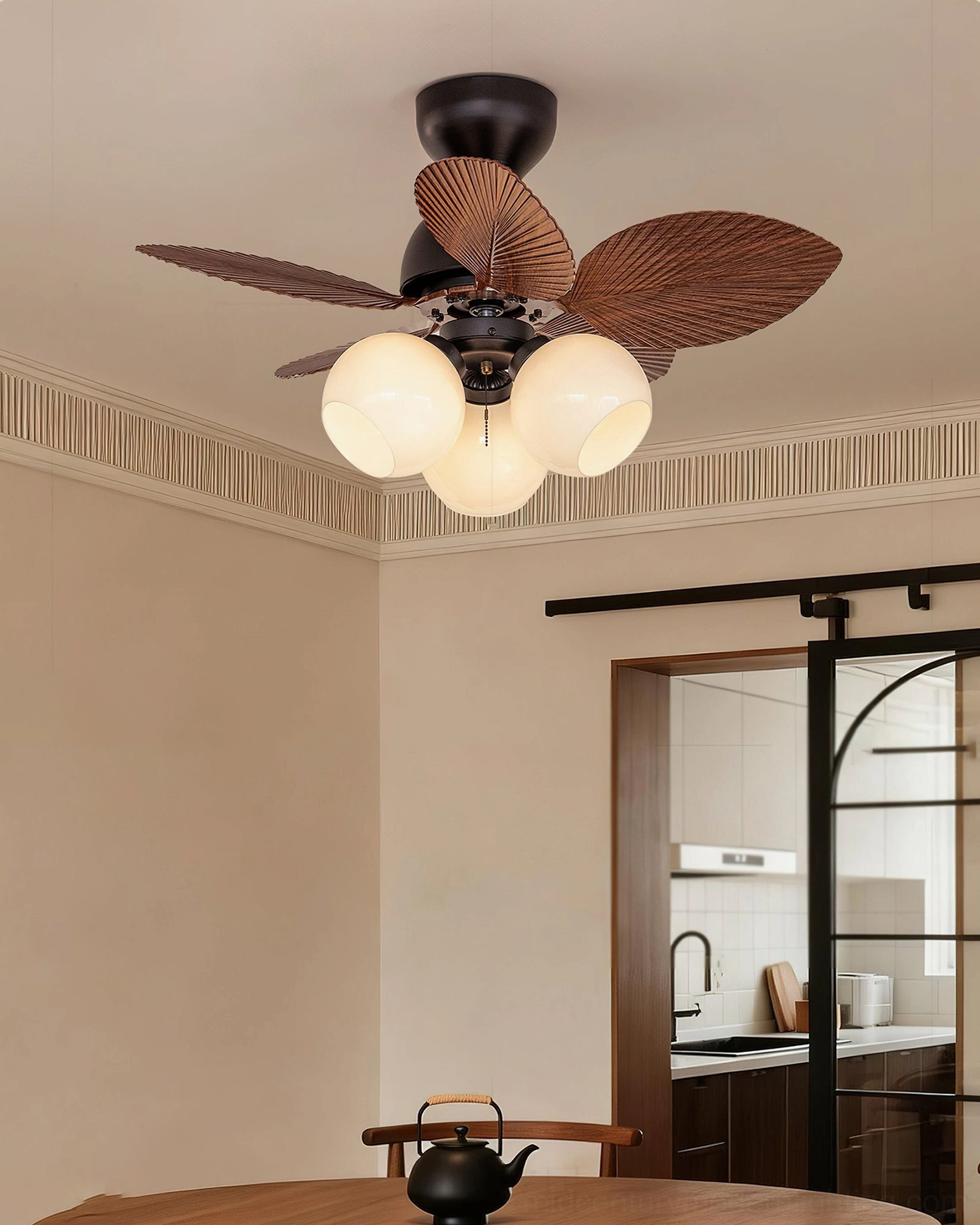 Belize ceiling fan light in eclectic dining space with sculptural palm-blade design and warm ambient lighting