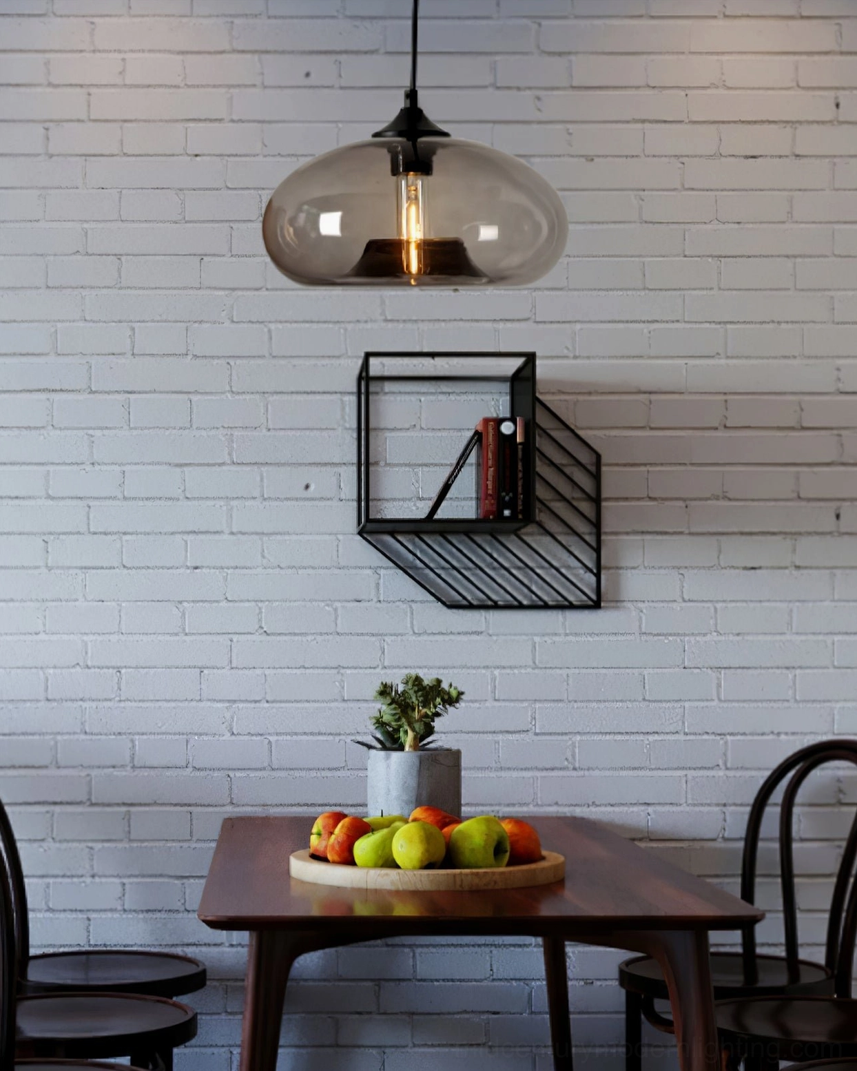 Bella pendant lamp with amber-tinted hand-blown glass shade hanging in industrial dining space with brick wall