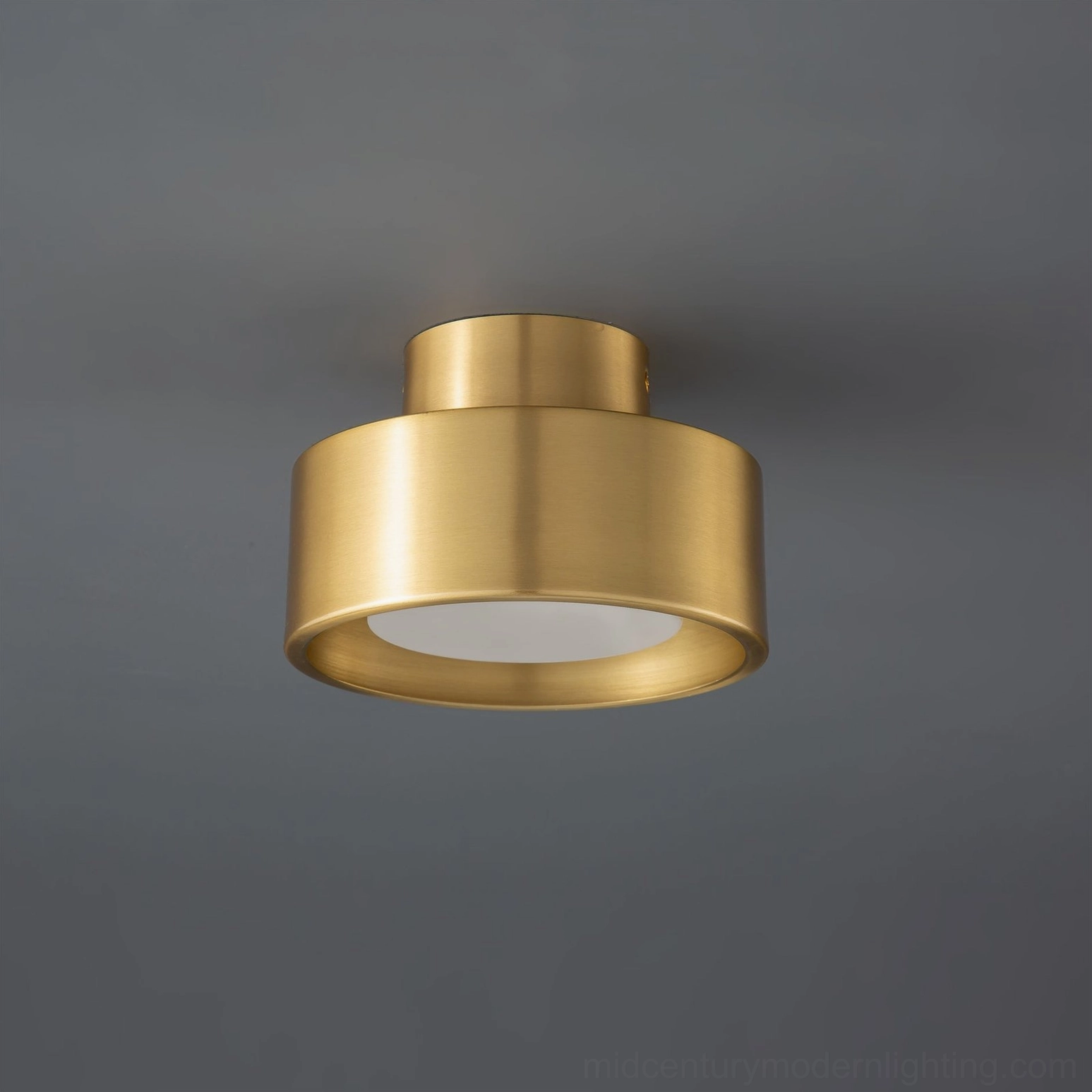 Bella brass gold flush mount ceiling lamp with white acrylic light diffuser in close-up front view
