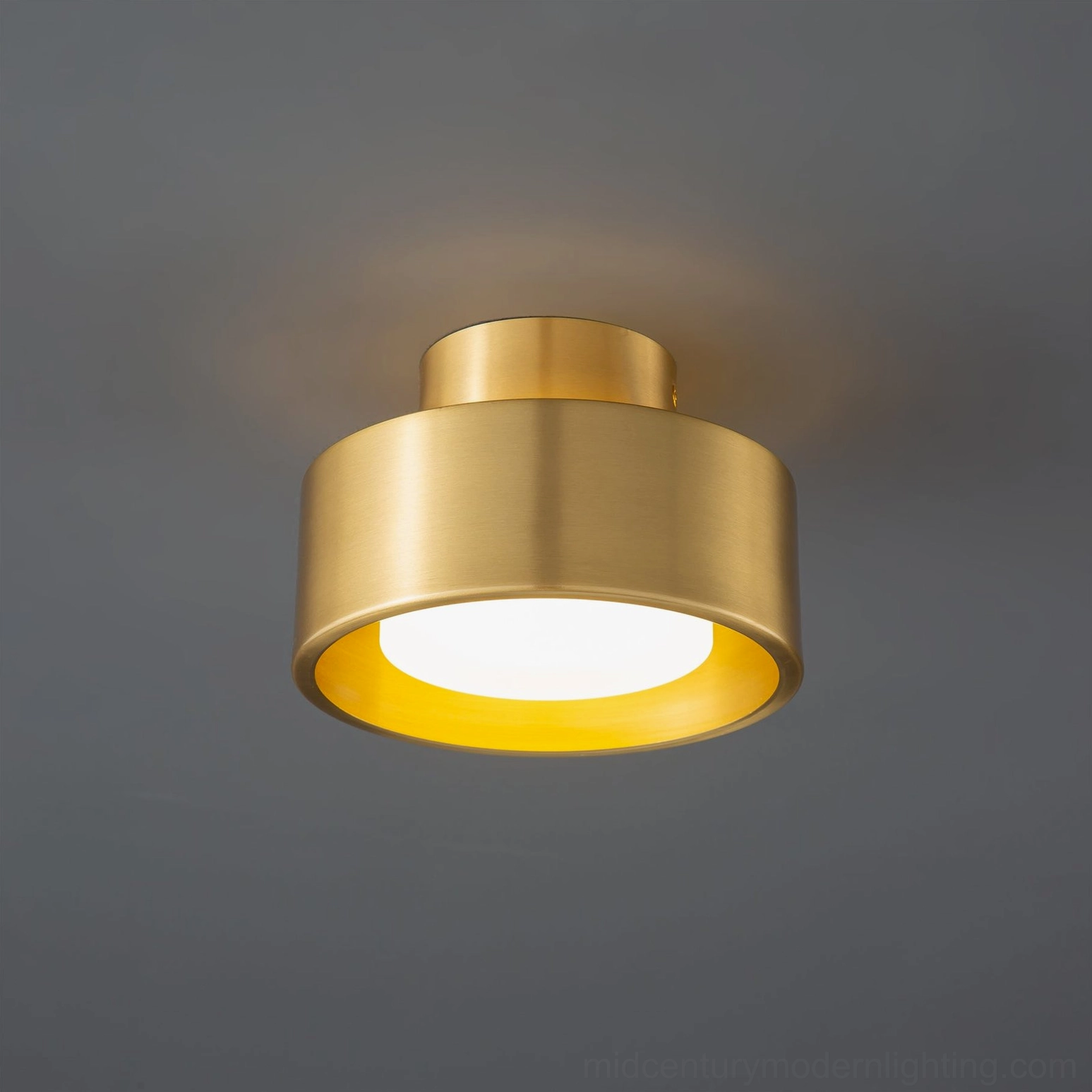Bella modern flush mount ceiling light fixture in warm brass tone showing integrated LED and acrylic construction detail