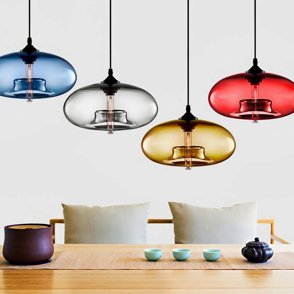 Bella hand-blown glass pendant with clear shade in minimalist modern home setting, architectural lighting