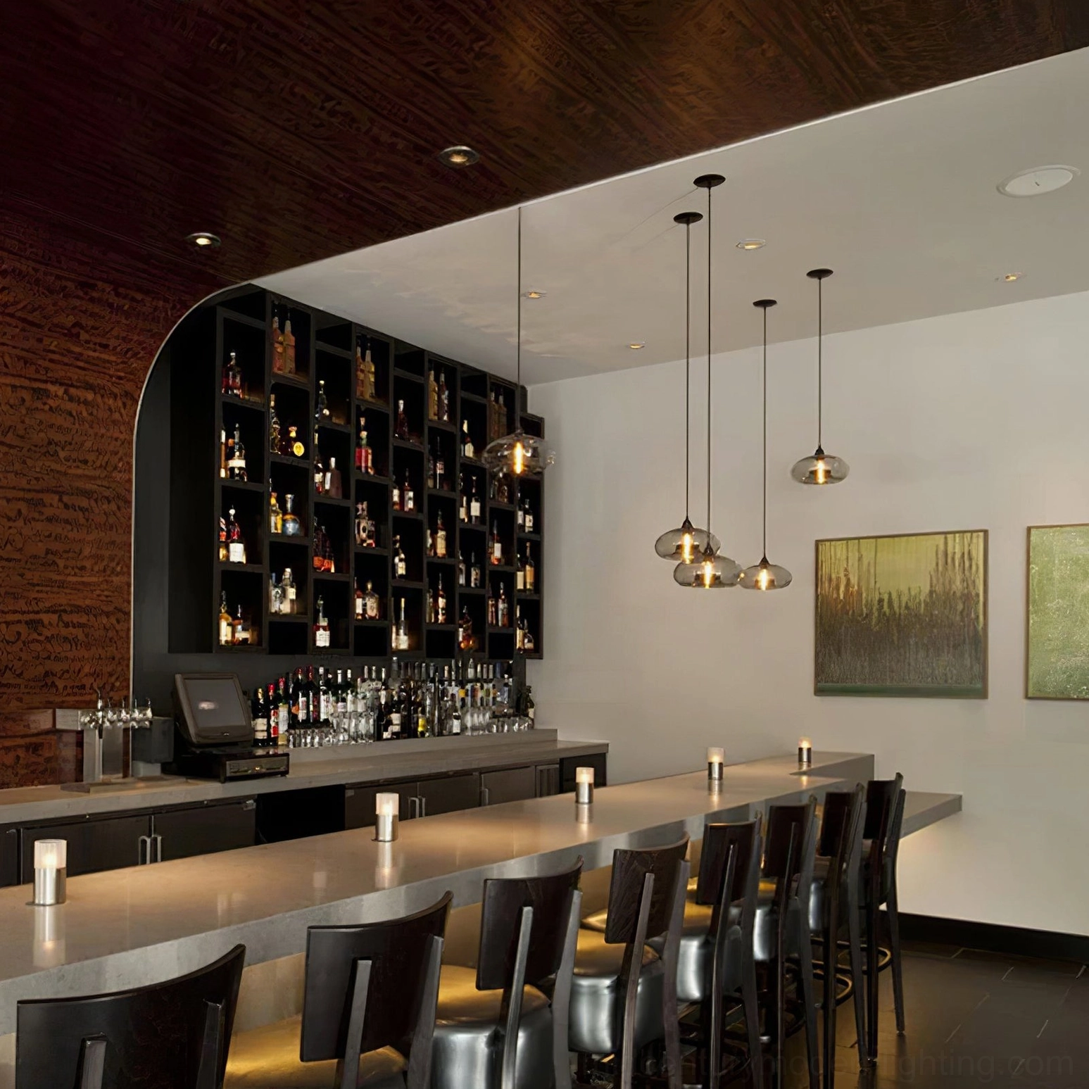 Two Bella clear glass pendants with black fittings in contemporary space showing scale and proportion