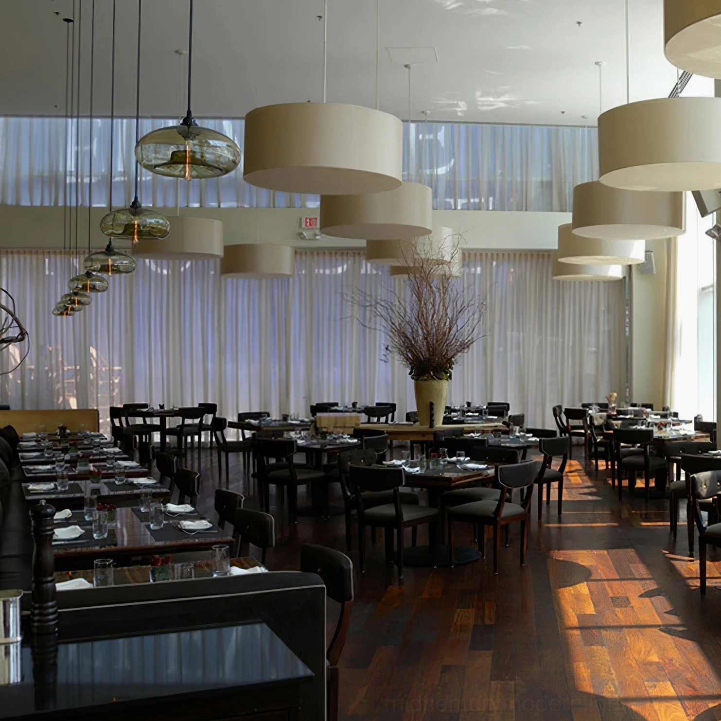 Bella glass pendant lamps showing various installation heights and cluster configurations for dramatic effect