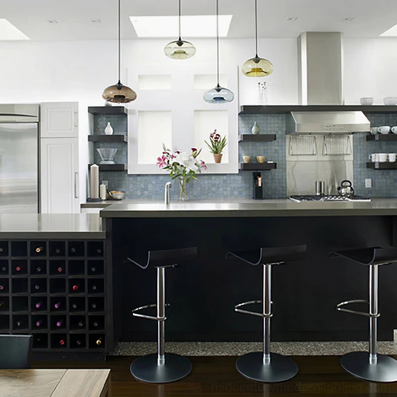 Single Bella hand-blown glass pendant with matte black hardware, sculptural modern design accent light