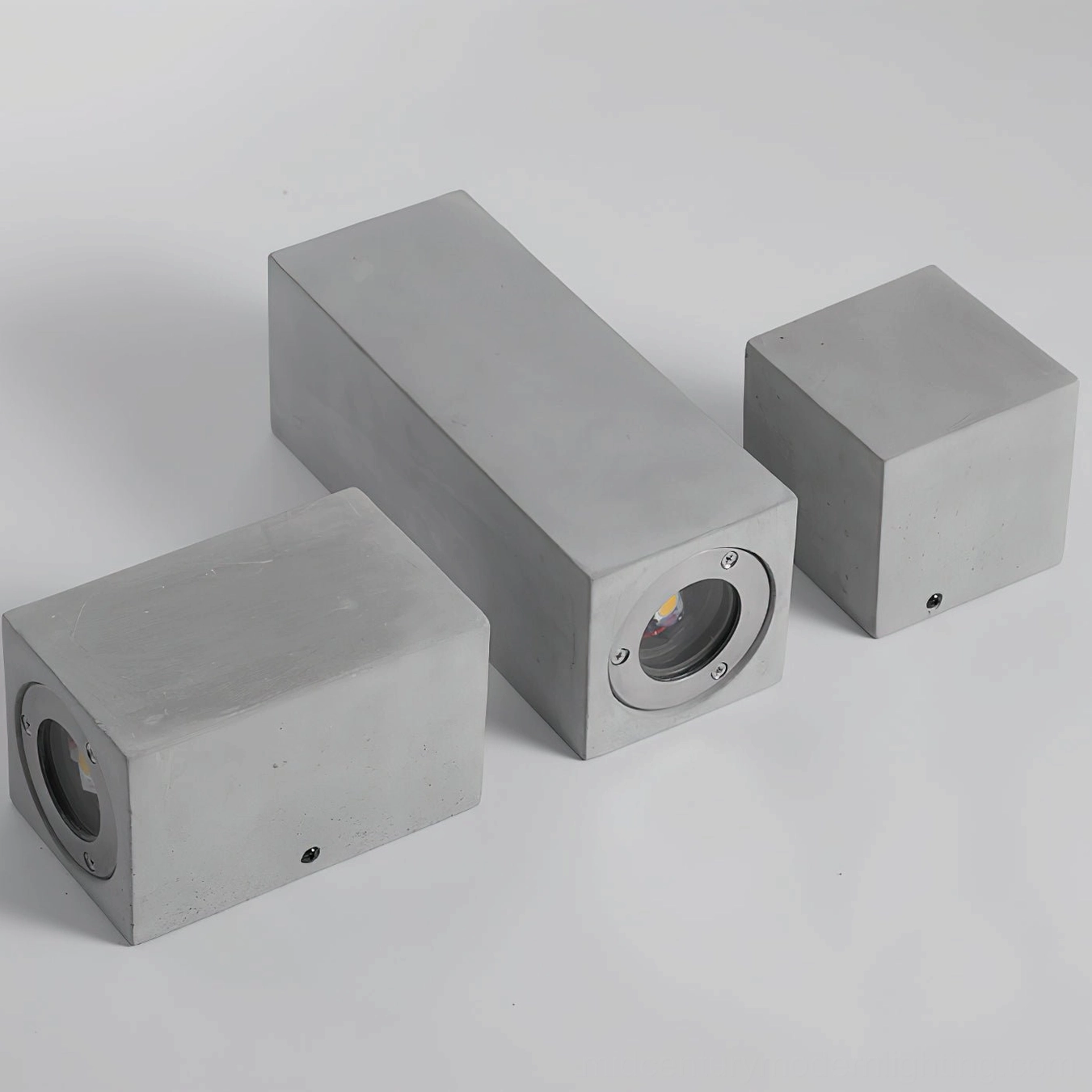 Bentu assorted concrete lighting fixtures angled overhead view mixed square rectangular forms industrial style