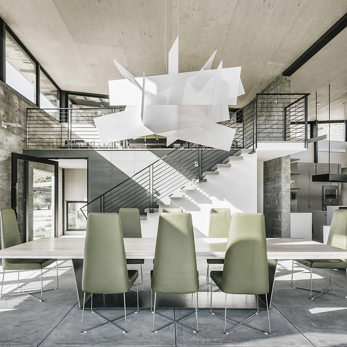 Big Bang large pendant chandelier open-concept loft expansive modern dining space industrial aesthetic