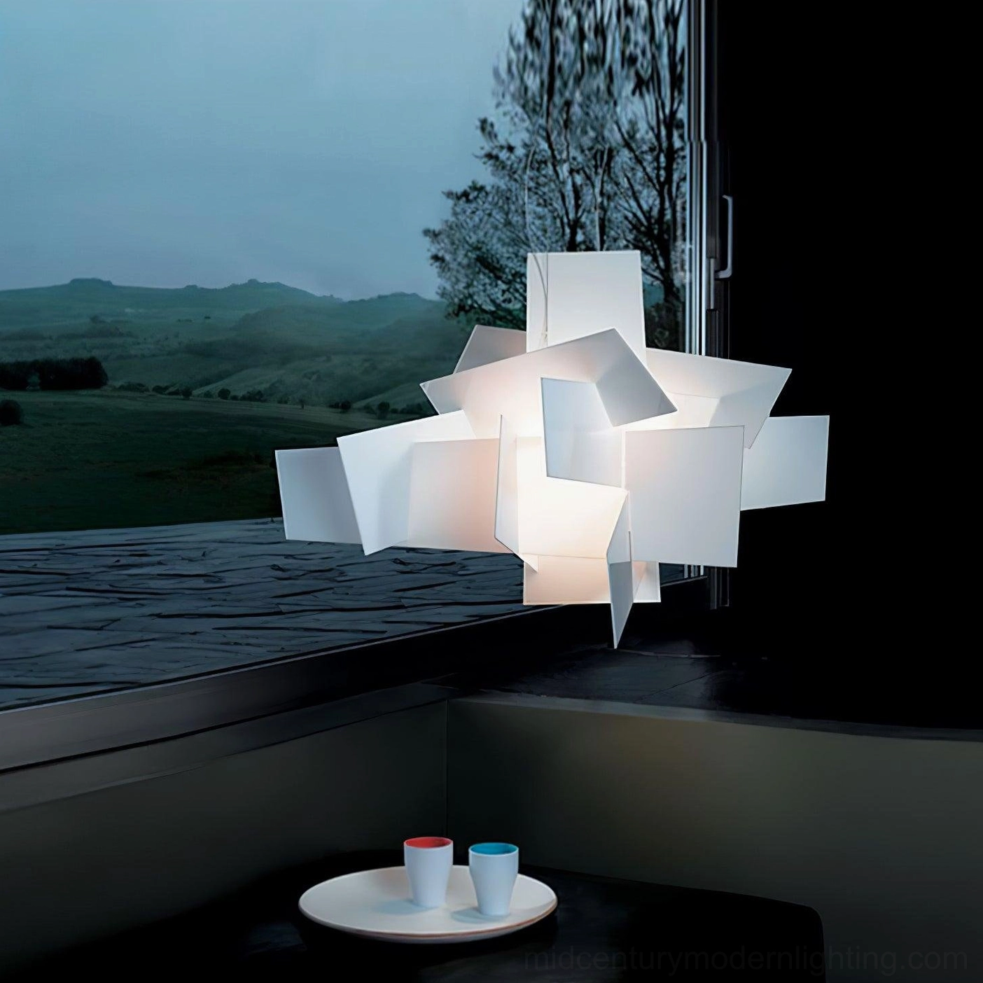 Big Bang geometric pendant near stone windowsill coffee cups minimalist interior modern nook