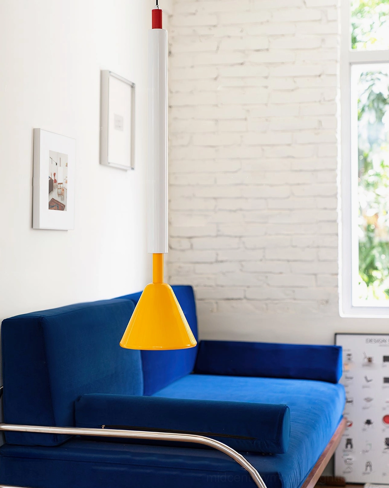 Billy yellow cone pendant light above blue fabric sofa - exposed brick wall mid-century aesthetic