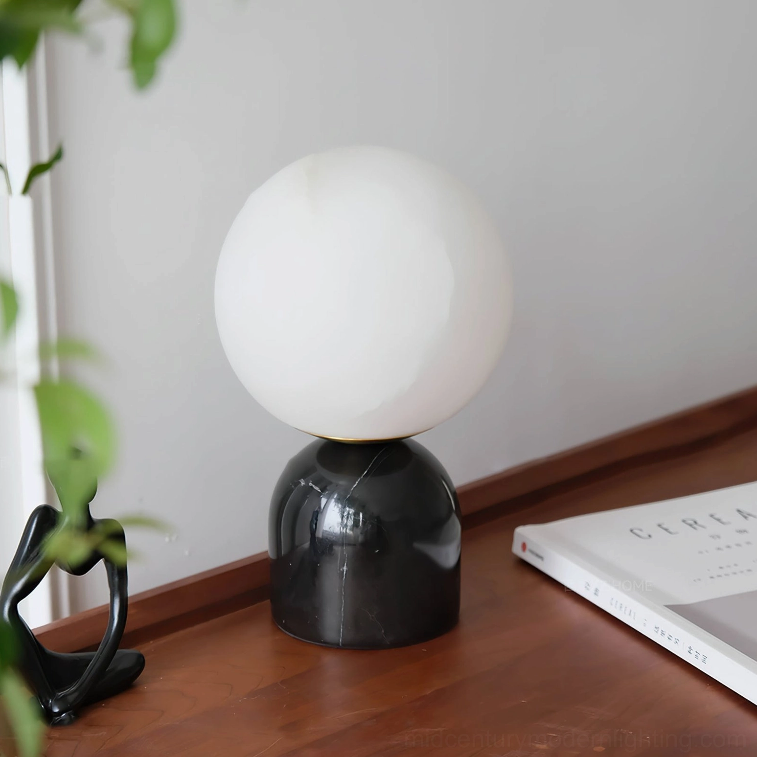Billy alabaster table lamp on wooden bedside table with abstract sculpture modern bedroom