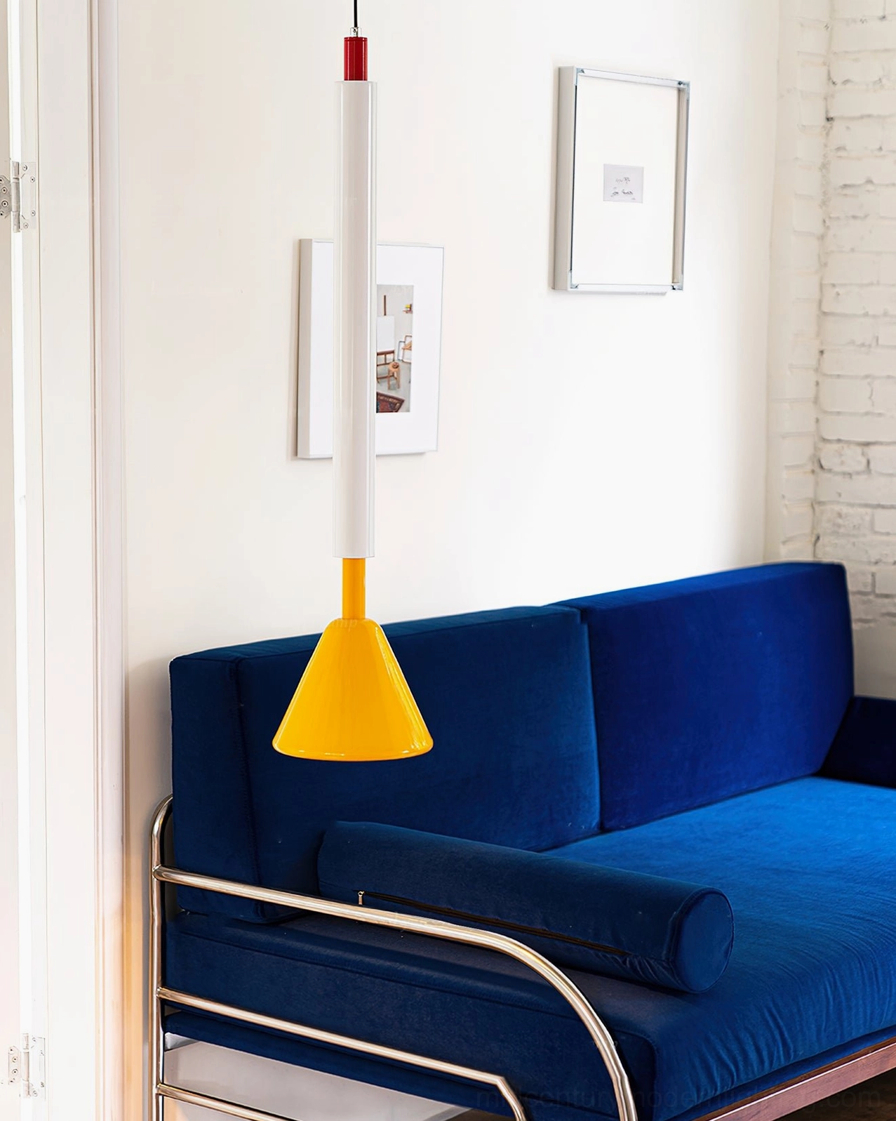 Billy geometric pendant lamp in minimalist living space - primary color cone design