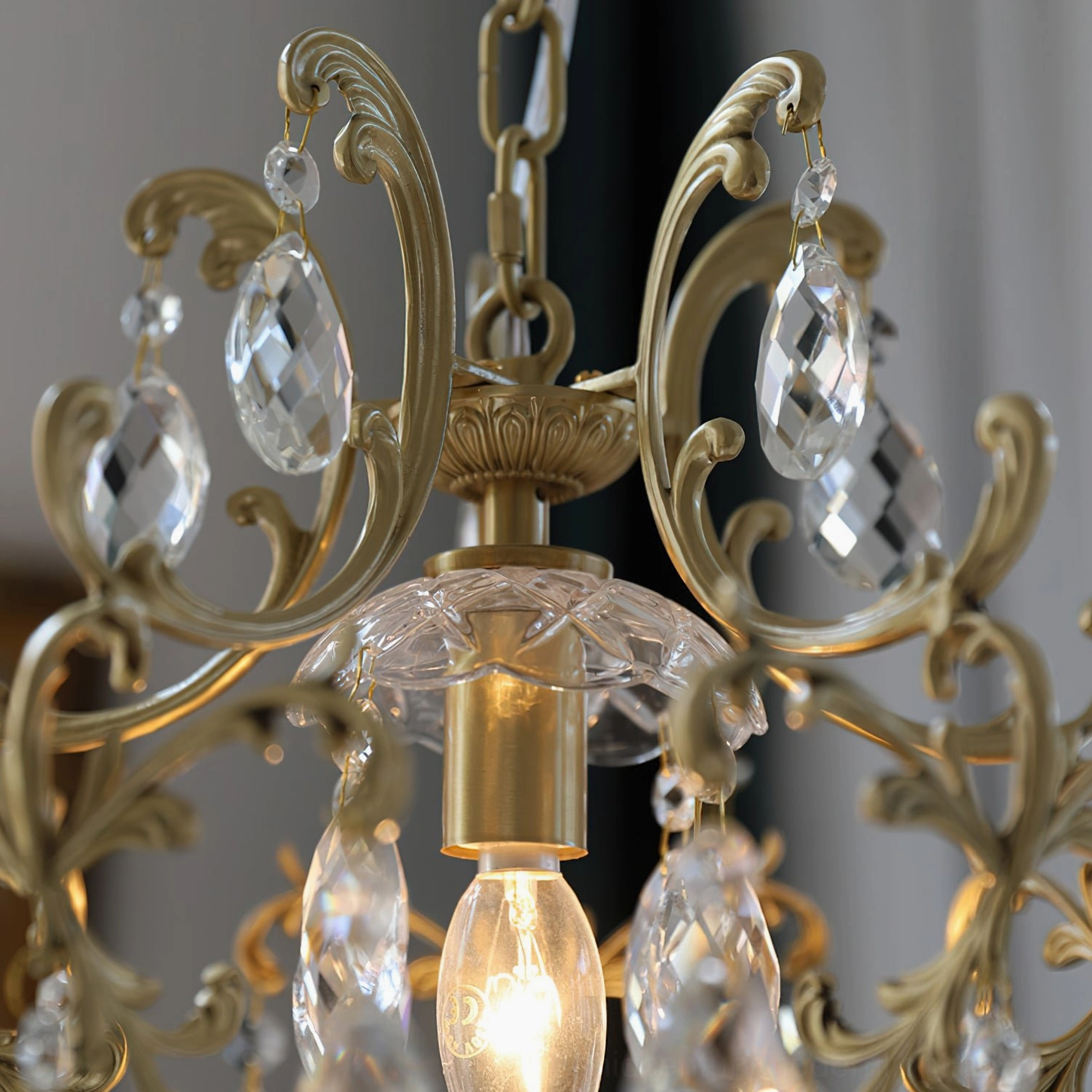 Birdcage pendant light with decorative brass frame and crystal drops in home interior setting showcase