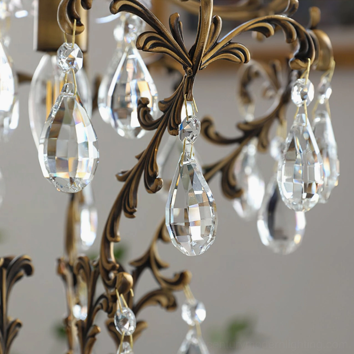 Birdcage pendant light with warm brass finish and crystal accents in elegant interior space three-quarter view