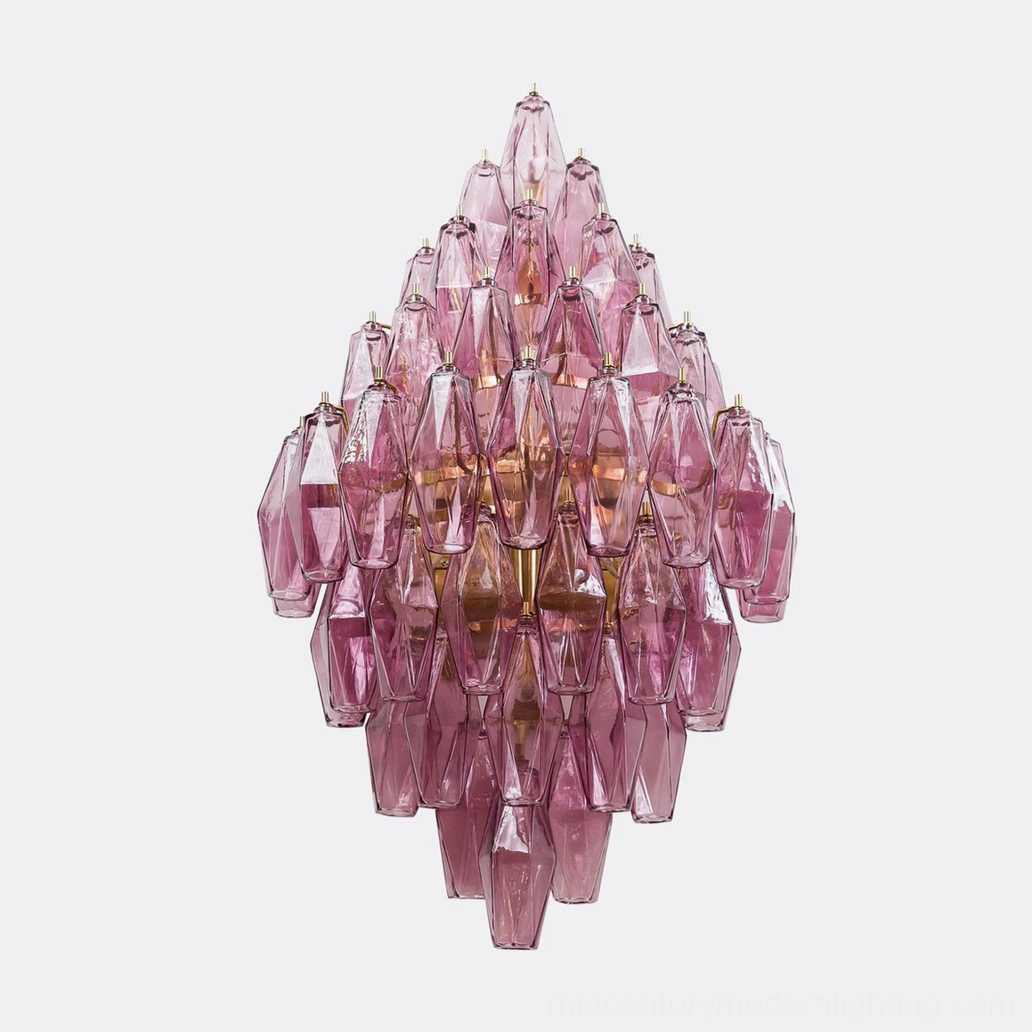 Biscayne polyhedral glass sconce amber finish with warm light glow through geometric glass