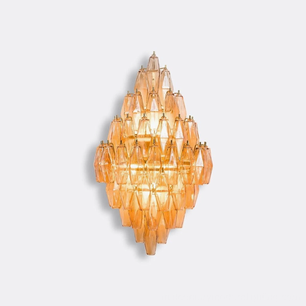 Polyhedral glass sconce showing bulb configuration and internal light source placement