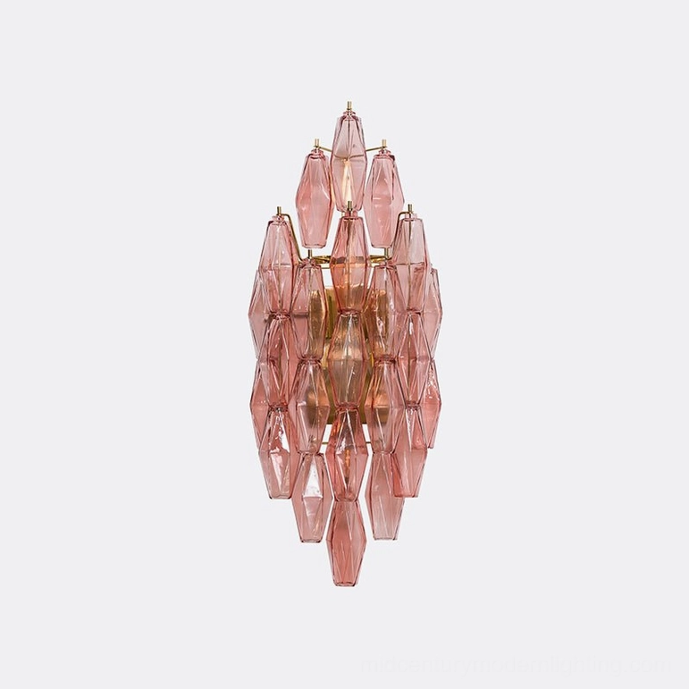 Pink and gold polyhedral glass wall sconce with layered glass prisms and metal chassis
