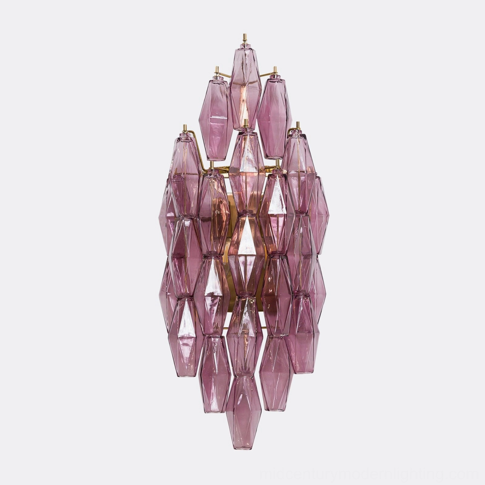 Polyhedral glass wall sconce showing three-dimensional geometric faceted pattern and light transmission