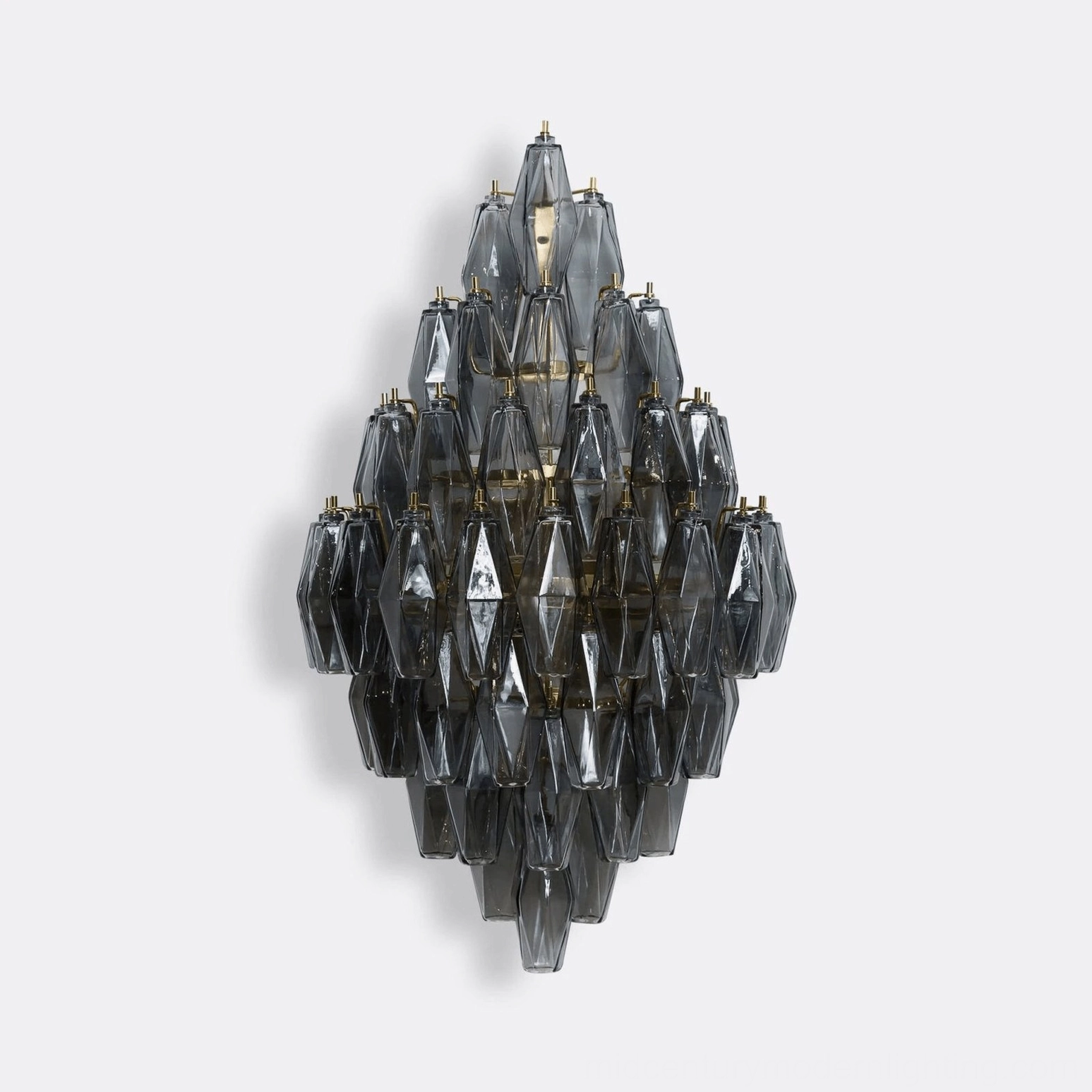 Polyhedral glass wall sconce with precise geometric faceted design and metal frame, direct frontal angle