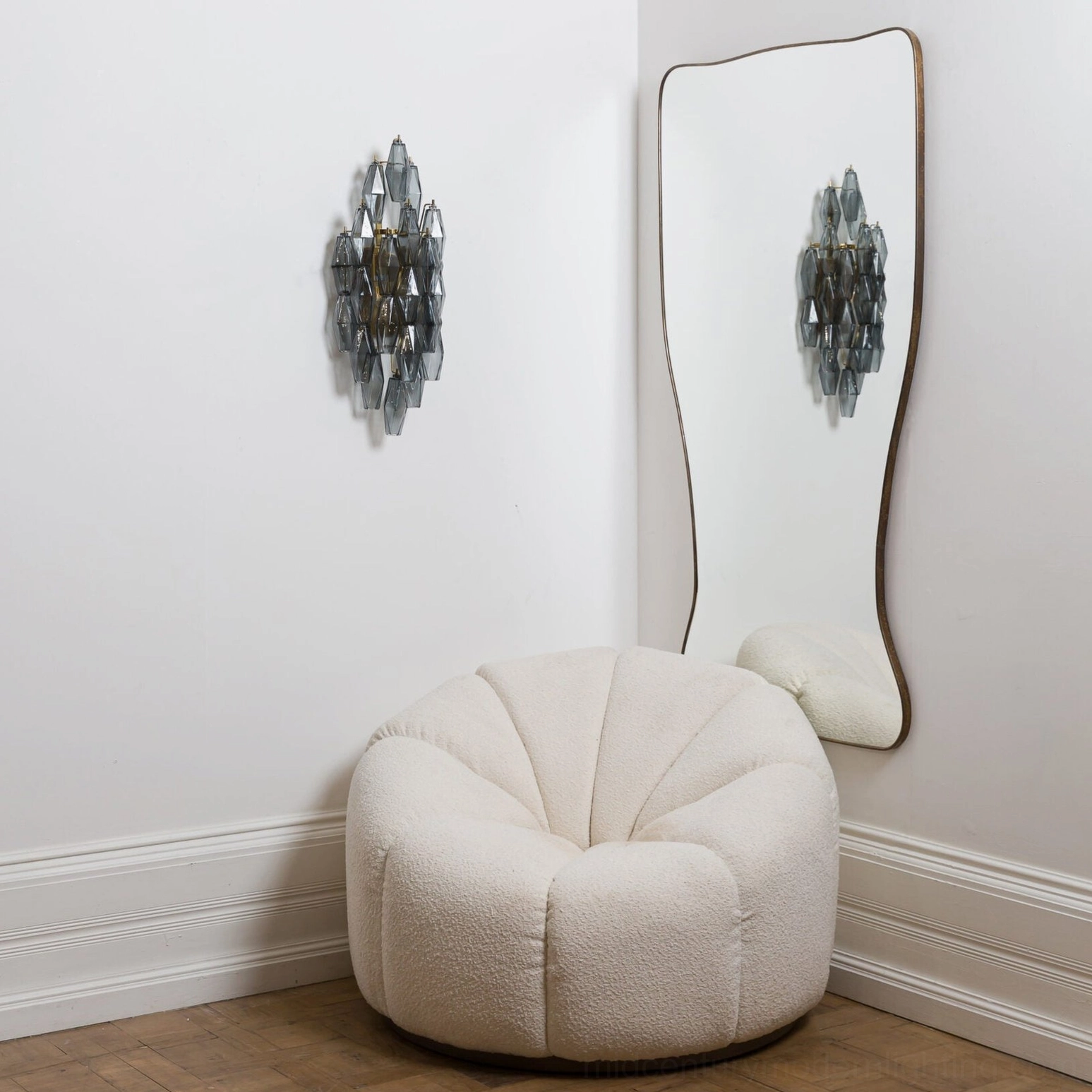 Smoky grey polyhedral glass wall sconce geometric layered design in minimalist living room setting