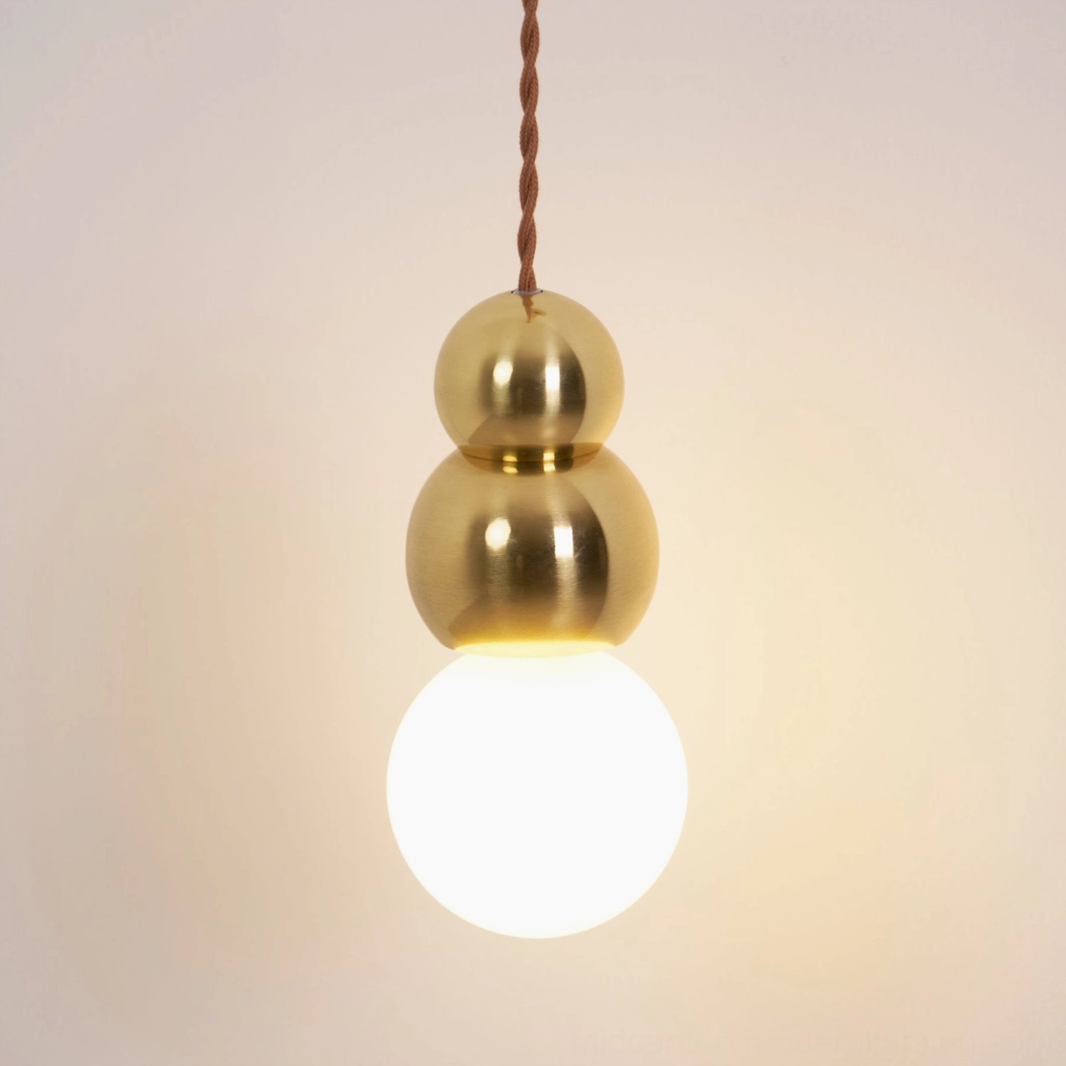 Black finish ball wall sconce in modern interior, minimalist pendant light, sleek contemporary design