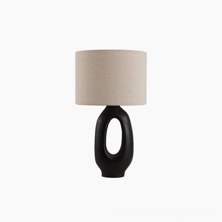 Black and Linen Sauce table lamp balancing industrial drama with soft organic fabric shade diffusion