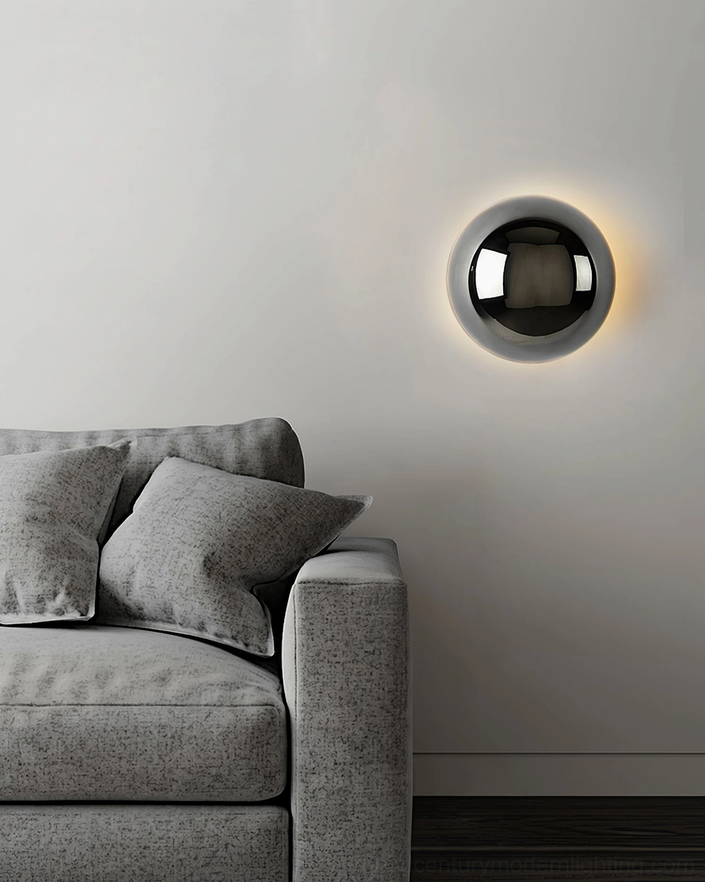 Matte black sphere wall sconce with adjustable pull mechanism in minimalist modern interior