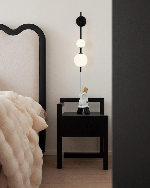 Black metal vertical globe wall lamp with frosted glass shades in luxury modern bedroom setting