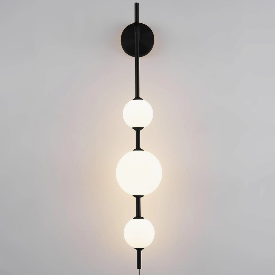 Matte black vertical globe wall lamp with frosted glass globes, contemporary home décor lighting