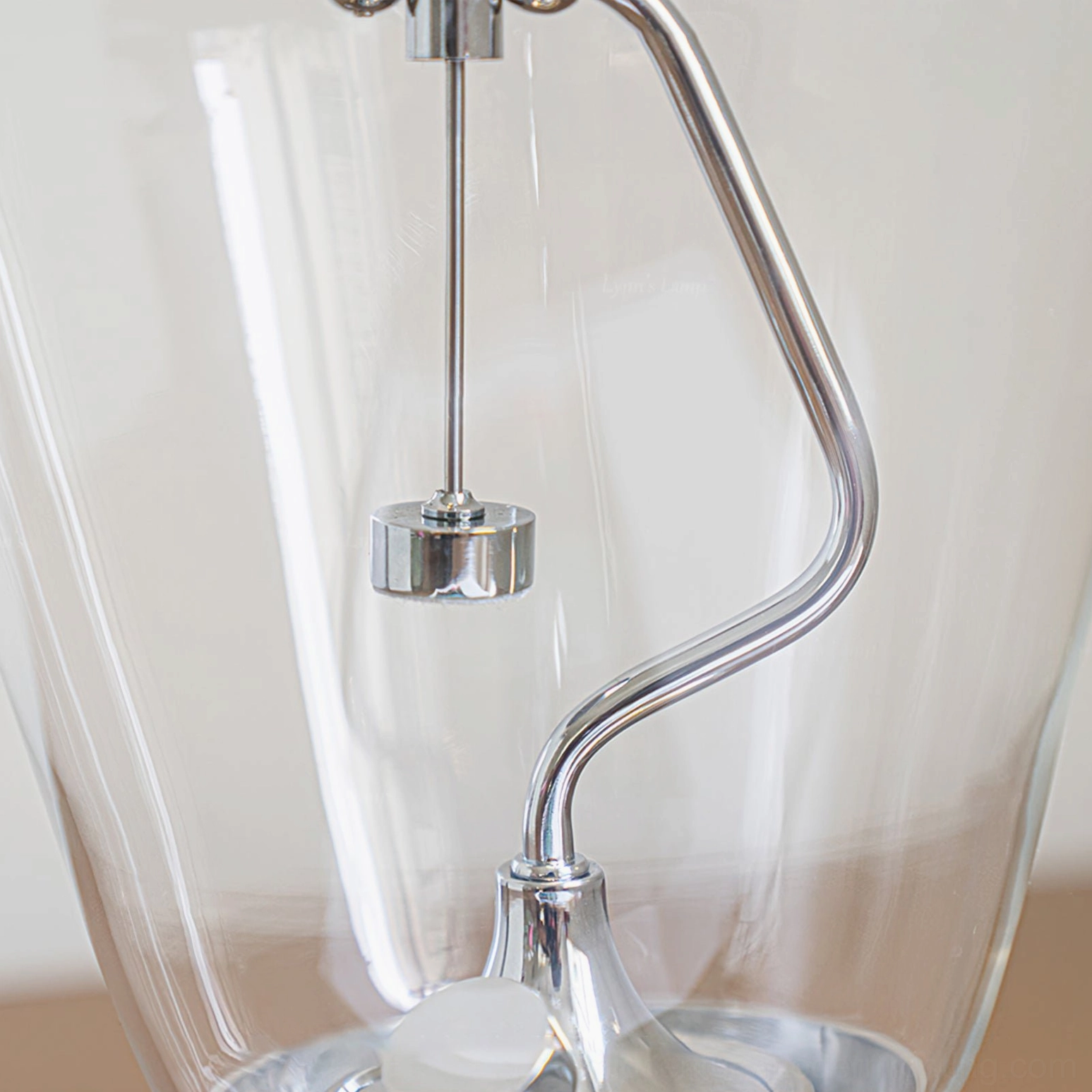 Blow lamp interior mechanism close-up front view with chrome support rod and metal lamp holder