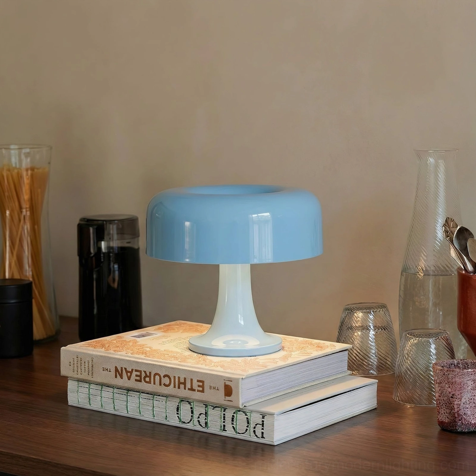 Blue-white mushroom table lamp placed on stacked decorative books on kitchen countertop, mid-century modern accent lighting