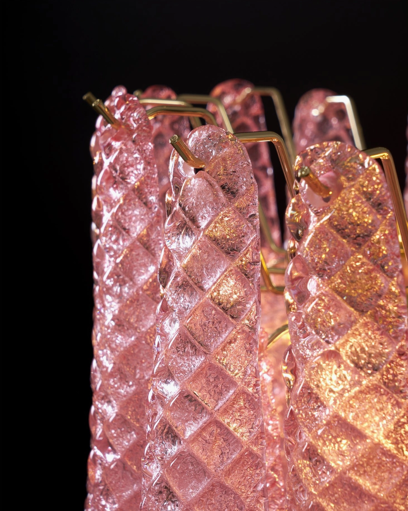 Viola pink glass chandelier highlighting blush tones and light-catching glass surfaces