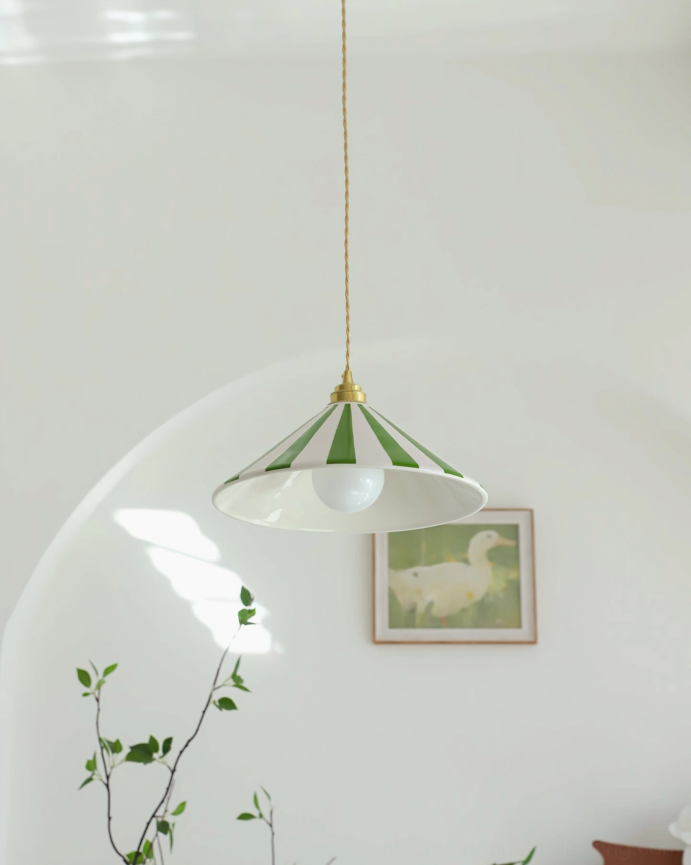 Bobine cone pendant light bringing warmth to eclectic interior design