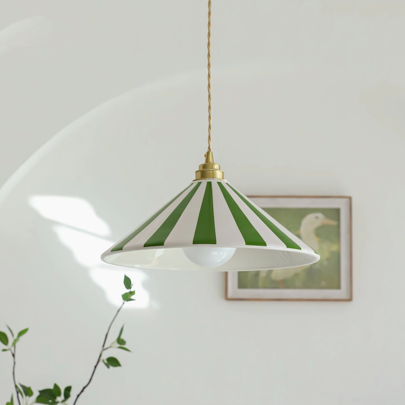 Green and white striped Bobine cone pendant light side view with twisted cord and brass hardware