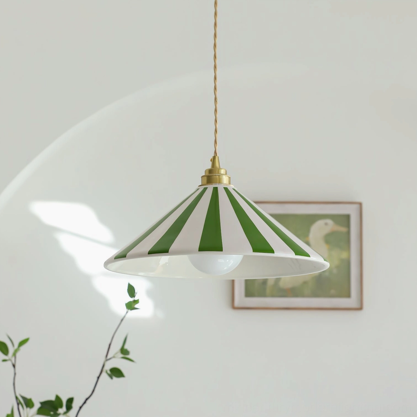 Bobine striped pendant light creating ambient lighting in styled interior