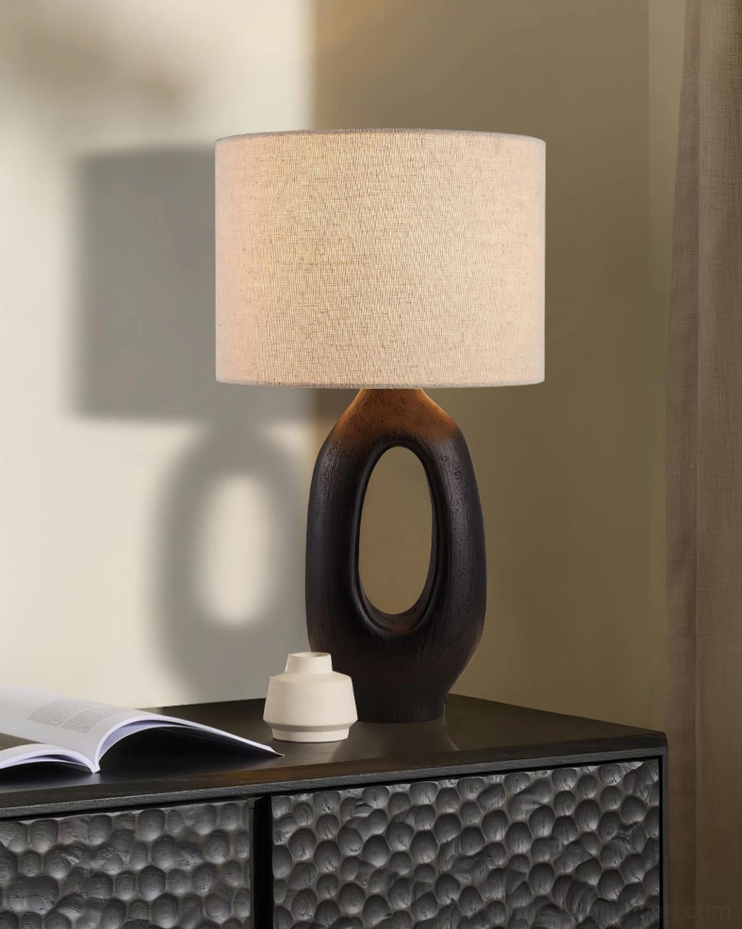 Sauce sculptural table lamp displayed in contemporary bohemian interior with layered vintage accessories