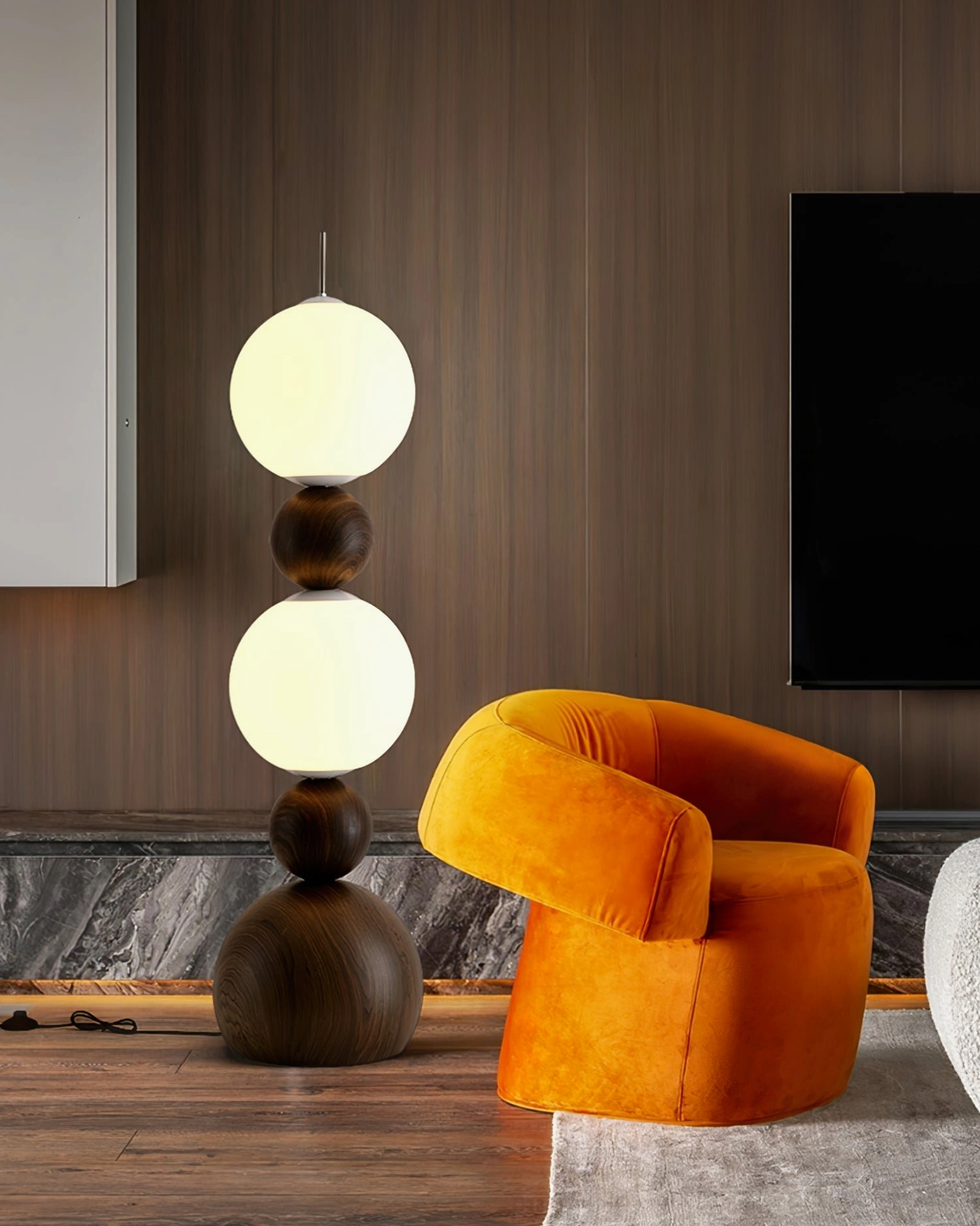 Bola floor lamp with dark walnut finish in modern minimalist living room with orange velvet accent chair