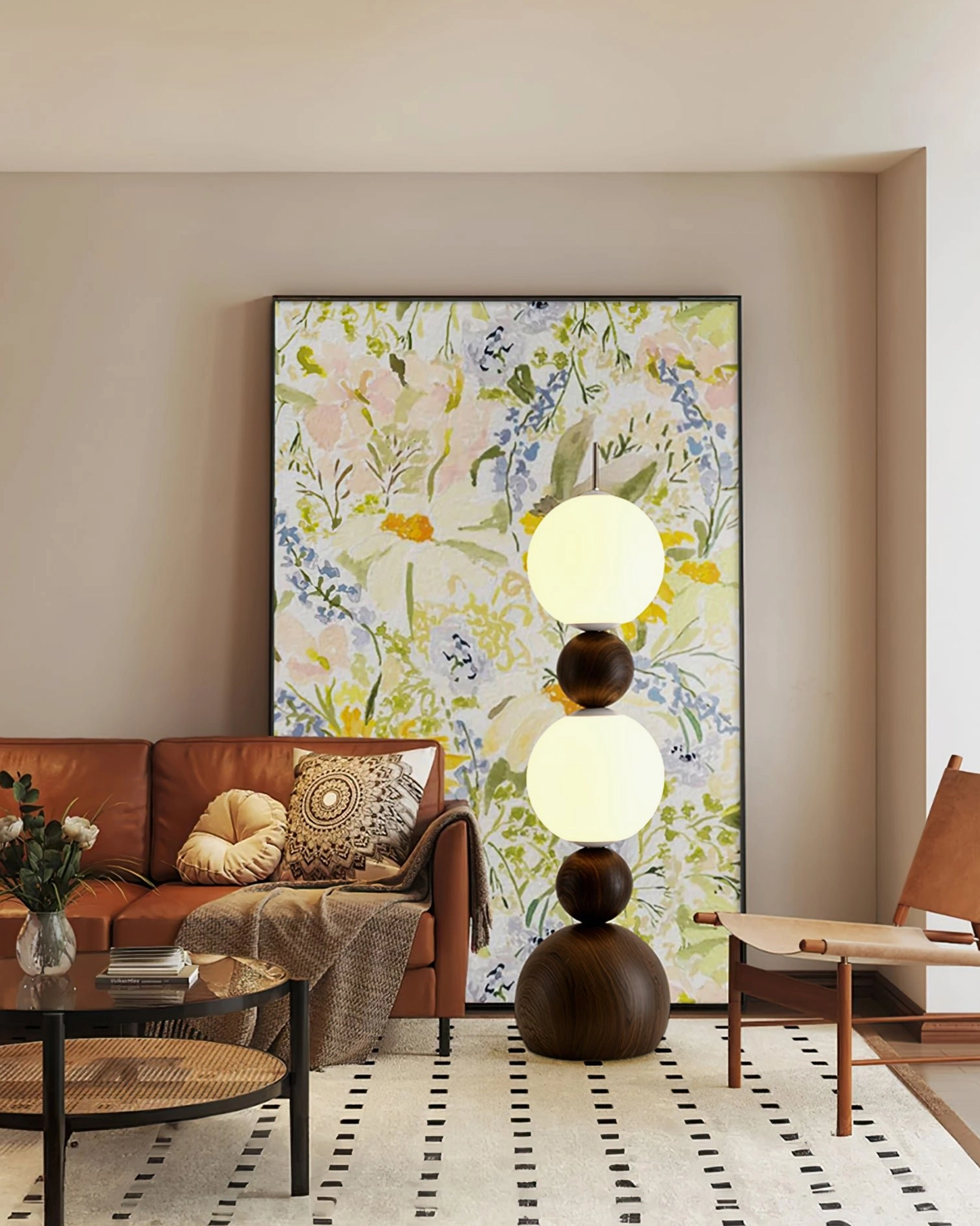 Illuminated Bola pendant-style floor lamp in cozy mid-century living room with floral wall art and warm decor