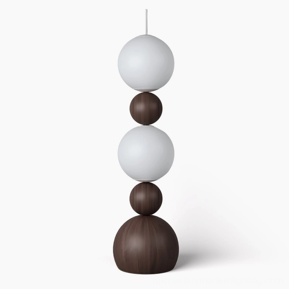 Bola stacked sphere floor lamp with frosted glass diffusers and dark brown wood frame on white background