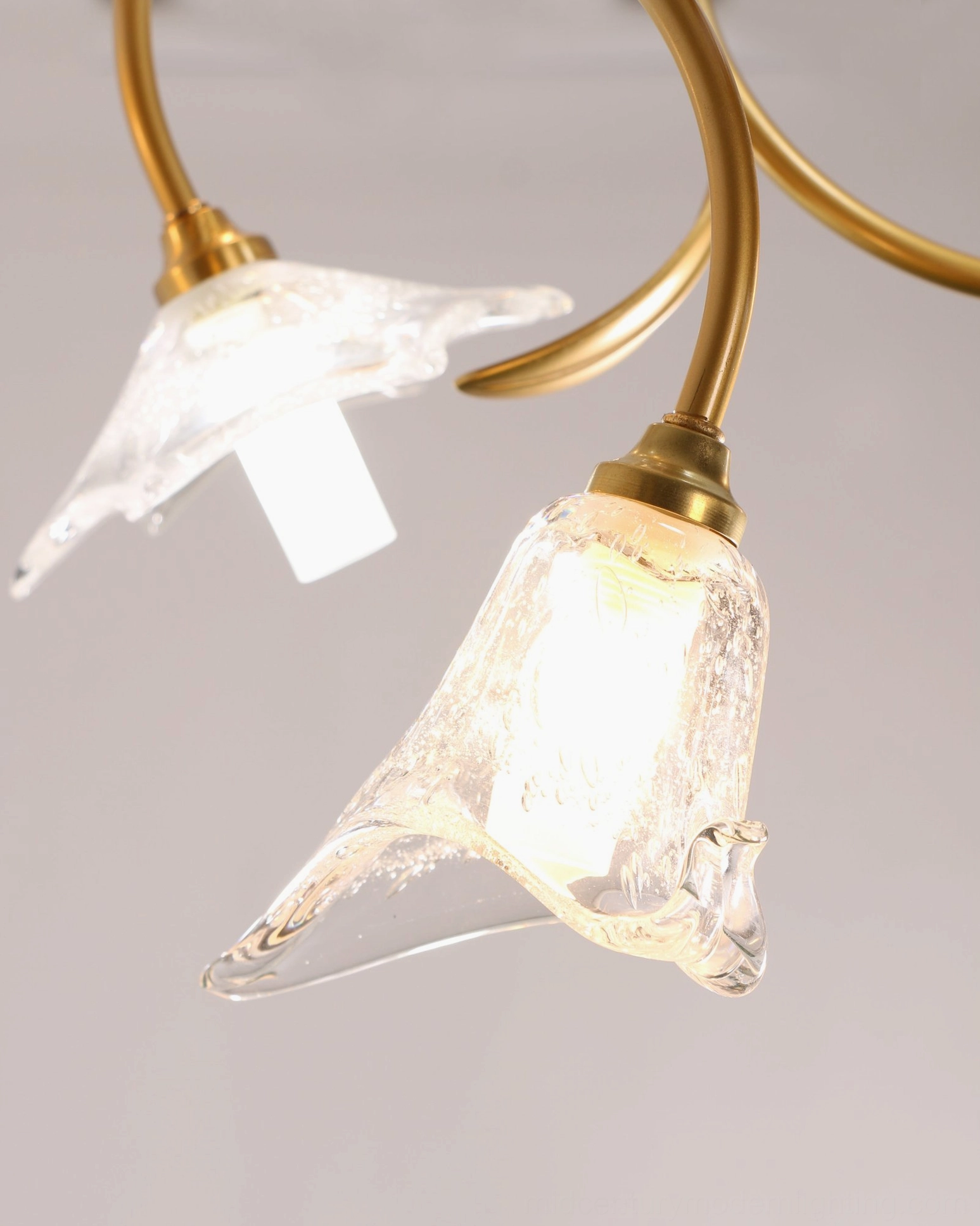 Botanical flower chandelier sculptural lighting installation with brass armature and glass bloom details