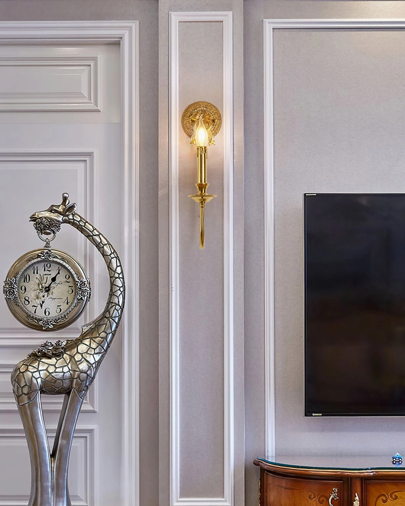 Bow brass wall sconce showcasing polished finish and sculptural curved arm design