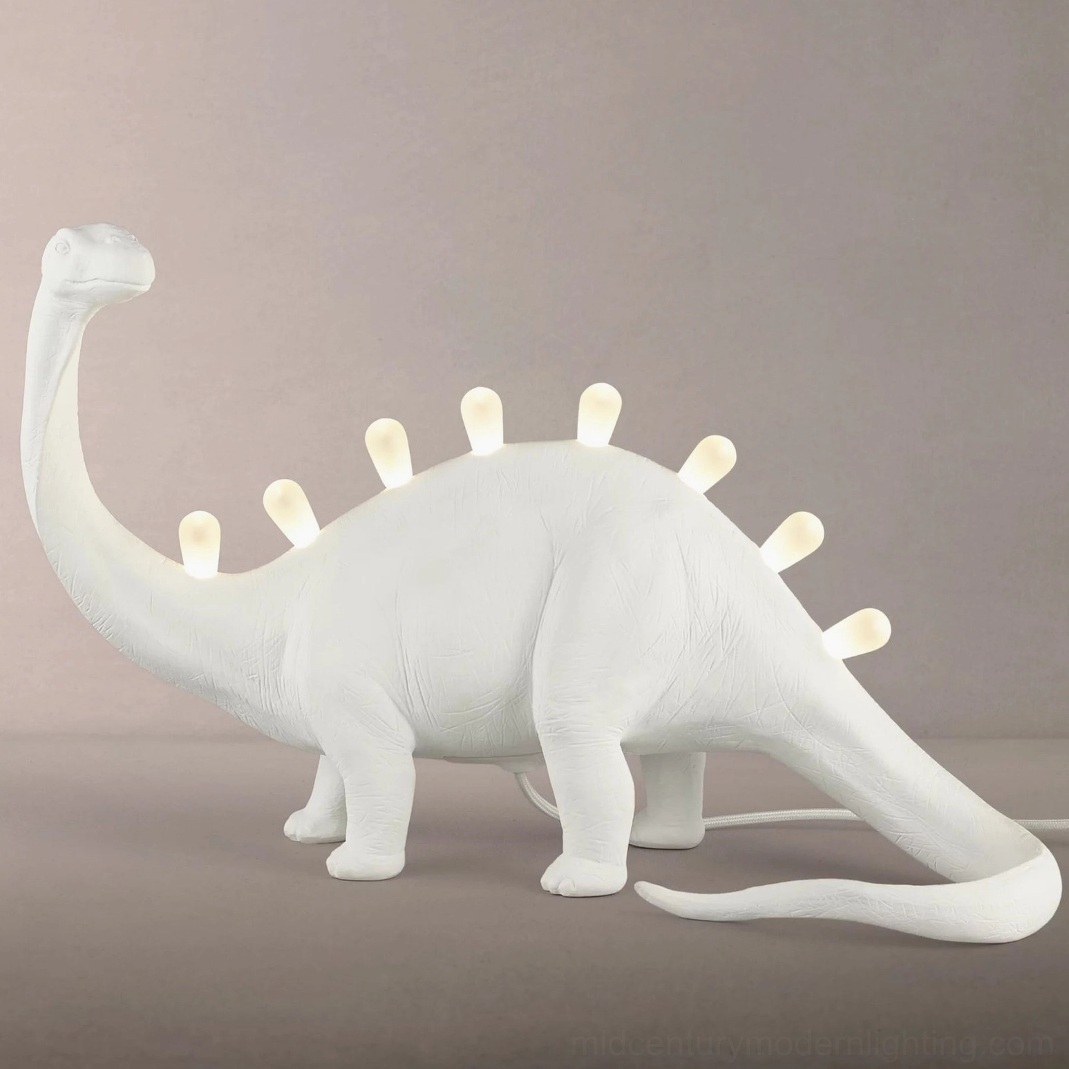 Brachiosaurus dinosaur table lamp in matte white, full side profile showcasing long neck design