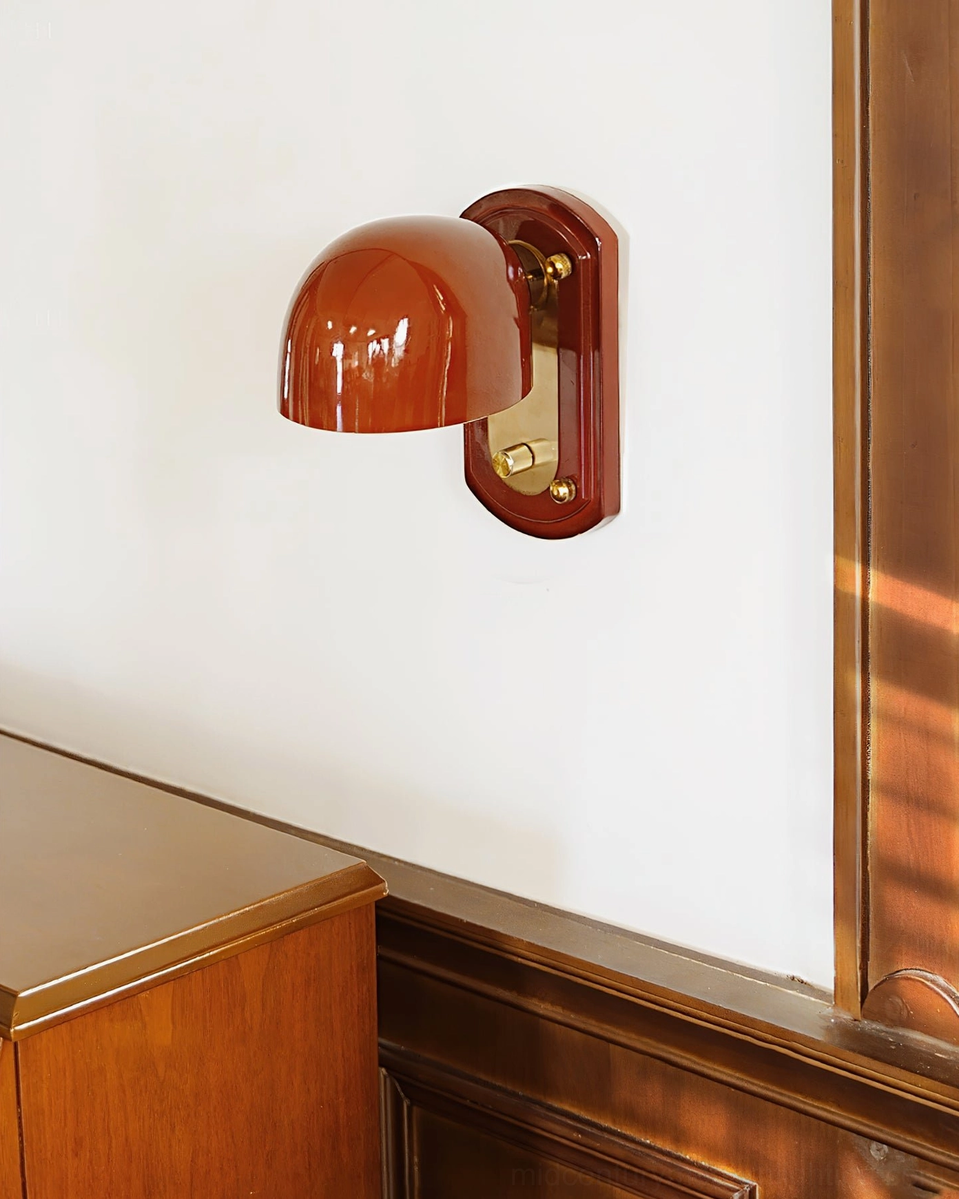 Side profile close-up of Bradley vintage wall fixture showing glossy brown dome shade and dark wood backplate