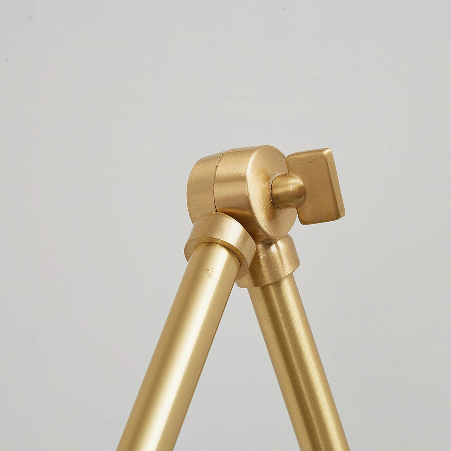 Brady swing arm wall lamp mounted low showing functional bedside reading position
