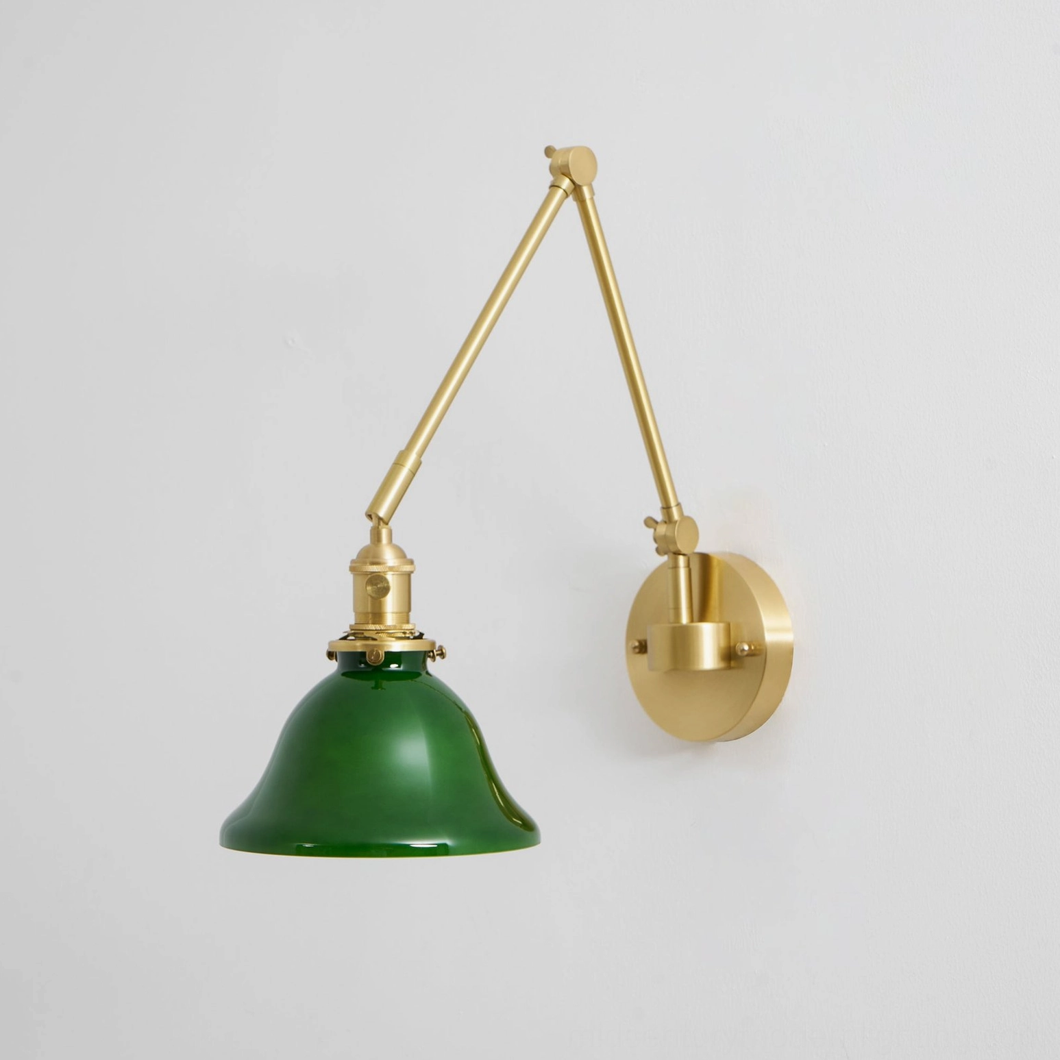 Brady swing arm wall lamp detail view of dual-joint articulation and green shade finish