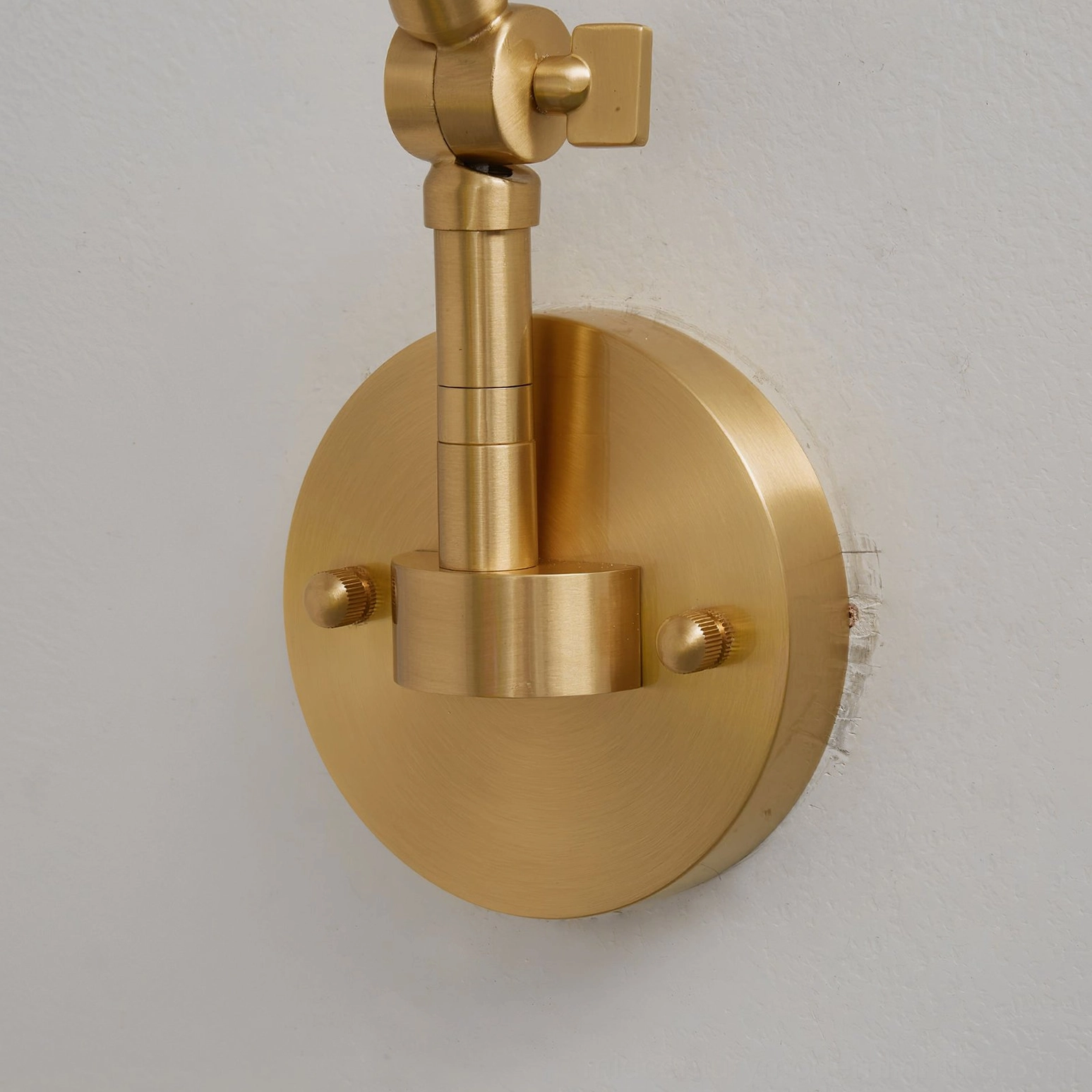 Brady wall lamp with warm ambient light creating cozy evening interior atmosphere